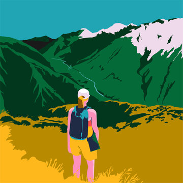 Young woman hiking stopped on the trail looking at a wonderful landscape with mountains and blue sky in the background.