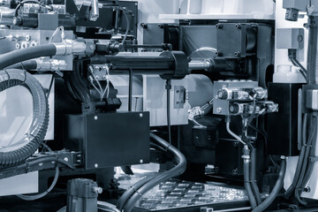 PVC plastic bottle production machine by extrusion and hot blowing technology, industrial concept background