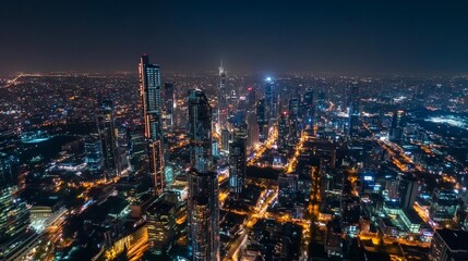 Obraz premium Night Skyline with Brightly Lit Skyscrapers Across City