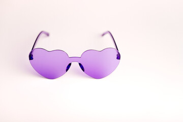 Trendy purple sunglasses with a unique frame design, stylish and modern accessory for any occasion.