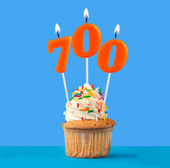 Candle number 700 - Number of followers or likes.