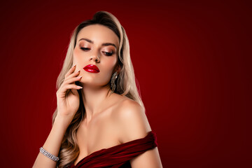 Stylish woman in red dress with blond hair showcasing luxury and beauty