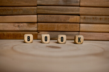 Book word on wooden blocks for reading and education concept