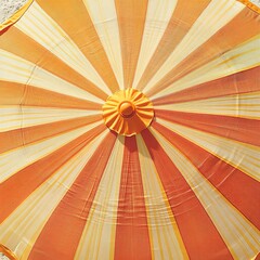 Striped beach umbrella cut out with yellow and orange gradient stripes, illuminated by golden sunlight, warm bold tones, intricate fabric texture, and eye-level view for vibrant visuals.