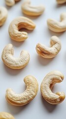 Cashew Nut Closeup: A close-up shot of raw cashew nuts, showcasing their unique kidney shape and creamy color, offering a view of their natural texture