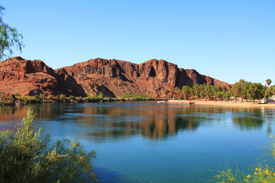 Mountain View in California across the Parker Strip of the Colorado River between Parker Dan and Headgate Dam in Buckskin Mountain State Park in Parker, Arizona, USA with blue sky copy space. 