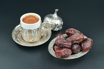 Holy month of Ramadan rituals with Turkish coffee and dates.Preferred foods and drinks for iftar. 