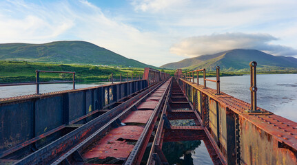 Remains of the abandoned rail way bridge over the river