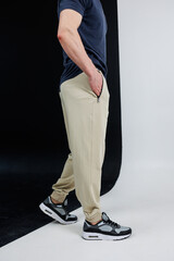 Stylish Casual Pants paired with Athletic Sneakers on a Trendy and Fashionable Model