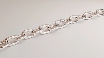 Obraz premium Silver Chain Link on White Background, A Study in Metal and Simplicity