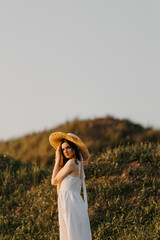A Serene and Beautiful Summer Portrait Depicting a Woman Wearing a Charming Straw Hat