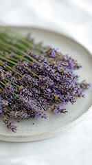 raw lavender flowers on white plate