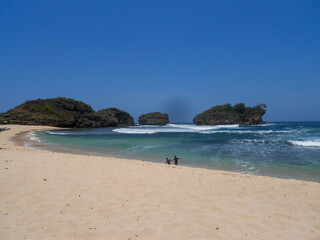 the beautiful charm of Klayar Beach, beach waves chasing each other at Klayar Beach, Pacitan, East Java, Indonesia