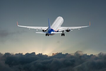 A white private plane in flight against blue sky