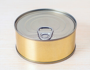An unopened tin can of tuna fish