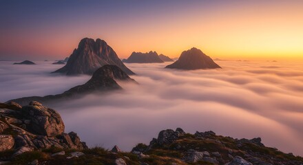 Majestic Mountain Peaks Above a Sea of Clouds at Sunset