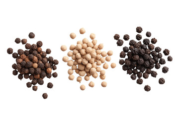 Three different colored pepper seeds are piled on top of each other, isolated