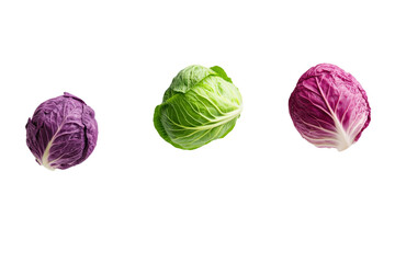 Obraz premium Three different colored cabbage heads are shown in the air, isolated