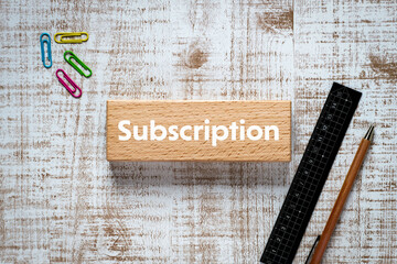 There is wood block with the word Subscription. It is as an eye-catching image.