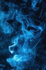 Fototapeta premium Ethereal Blue Smoke Swirling Against a Dark Background