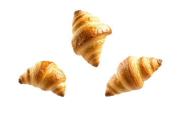 Three croissants are flying in the air, isolated