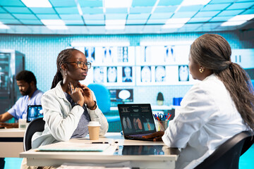 Fototapeta premium African american girl suffers from a sore throat and bronchial inflammation, discussing with otolaryngologist about flu pills. Patient with swallowing discomfort, painful sickness.