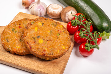 Round vegetarian patties or burgers made from grains, soybeans, vegetables and legumes