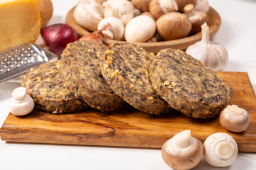 Tasty organic vegetarian food, burgers with champignons mushrooms, cheese and onion