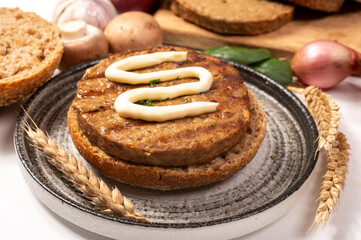 Make burger buns with vegan or vegetarian patties or burgers made from grains, vital wheat gluten food, grilled healthy food