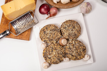 Tasty organic vegetarian food, burgers with champignons mushrooms, cheese and onion