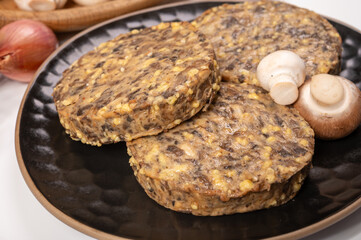 Tasty organic vegetarian food, burgers with champignons mushrooms, cheese and onion