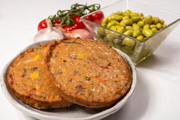 Round vegetarian patties or burgers made from grains, soybeans, vegetables and legumes