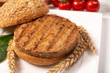Make burger buns with vegan or vegetarian patties or burgers made from grains, vital wheat gluten food, grilled healthy food
