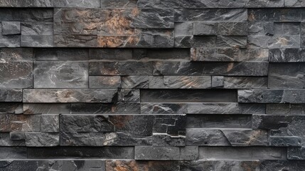 Naklejka premium Textured stone wall featuring varying shades of gray and hints of rust, ideal for architectural backgrounds