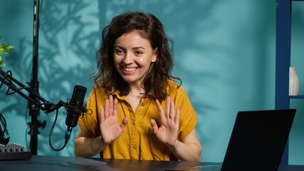 Content creator doing story time type of video for audience, filming in personal home studio. Media...