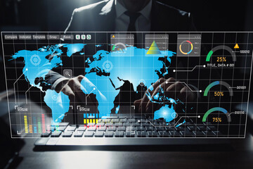 Businessman Using Digital Technology on Keyboard with Futuristic Interface Displaying Data, Charts, and World Map for Analytics and Global Insights