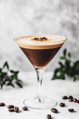 A realistic photograph of an espresso martini in a tall glass garnished with coffee beans and foam. The background is white to highlight the drinks rich brown tone. 
