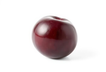 Obraz premium A single, ripe plum, perfectly isolated on a pure white background, ripe, white background