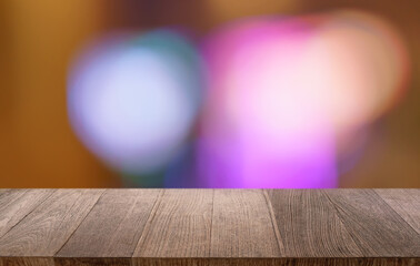 Empty wood table top and blur of restaurant background selective focus product display