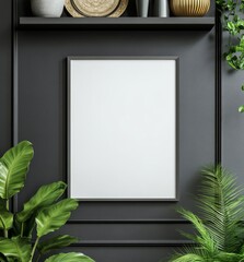 Blank framed poster on dark wall with plants and decorative items