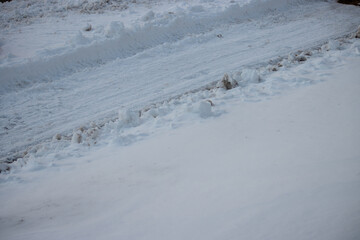 A plowed sidewalk during winter