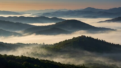 Obraz premium image captures peaceful and ethereal essence of a mountainous scenery enveloped in mist during early hours of day, Sunrise over the mountain peaks