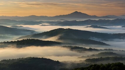 Obraz premium image captures peaceful and ethereal essence of a mountainous scenery enveloped in mist during early hours of day, Sunrise over misty mountain landscape