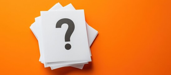 Orange background accentuates white paper and question mark design.