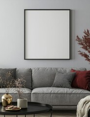 Blank framed poster on gray sofa living room