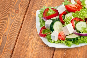 Fresh garden tasty salad with greens and vegetables