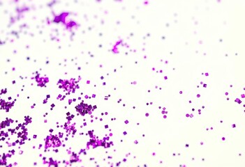 Naklejka premium Close-up of vibrant purple glitter scattered on pristine white , party, celebration