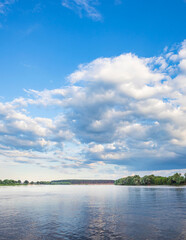 Calm lake with a cloudy sky in the background