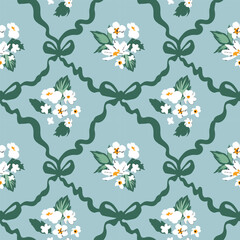 Delicate white flowers and green ribbons are arranged in a repeating pattern against a soft blue background, perfect for fabric or wallpaper design. The aesthetic captures a vintage charm.