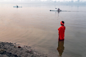 unidentified sadhu at yamuna river in Morning at Prayagraj uttar pradesh india
